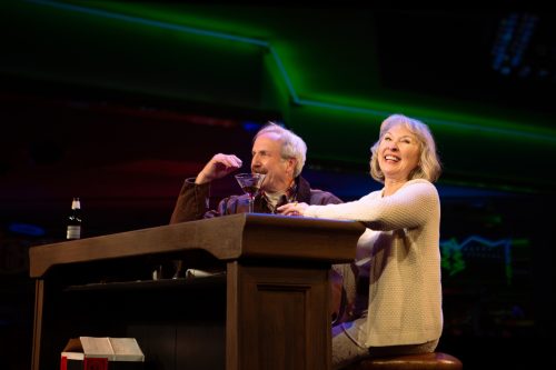 Jackie (Lorri Holt) meets Len (Dan Hiatt) at a bar in Lake Tahoe.