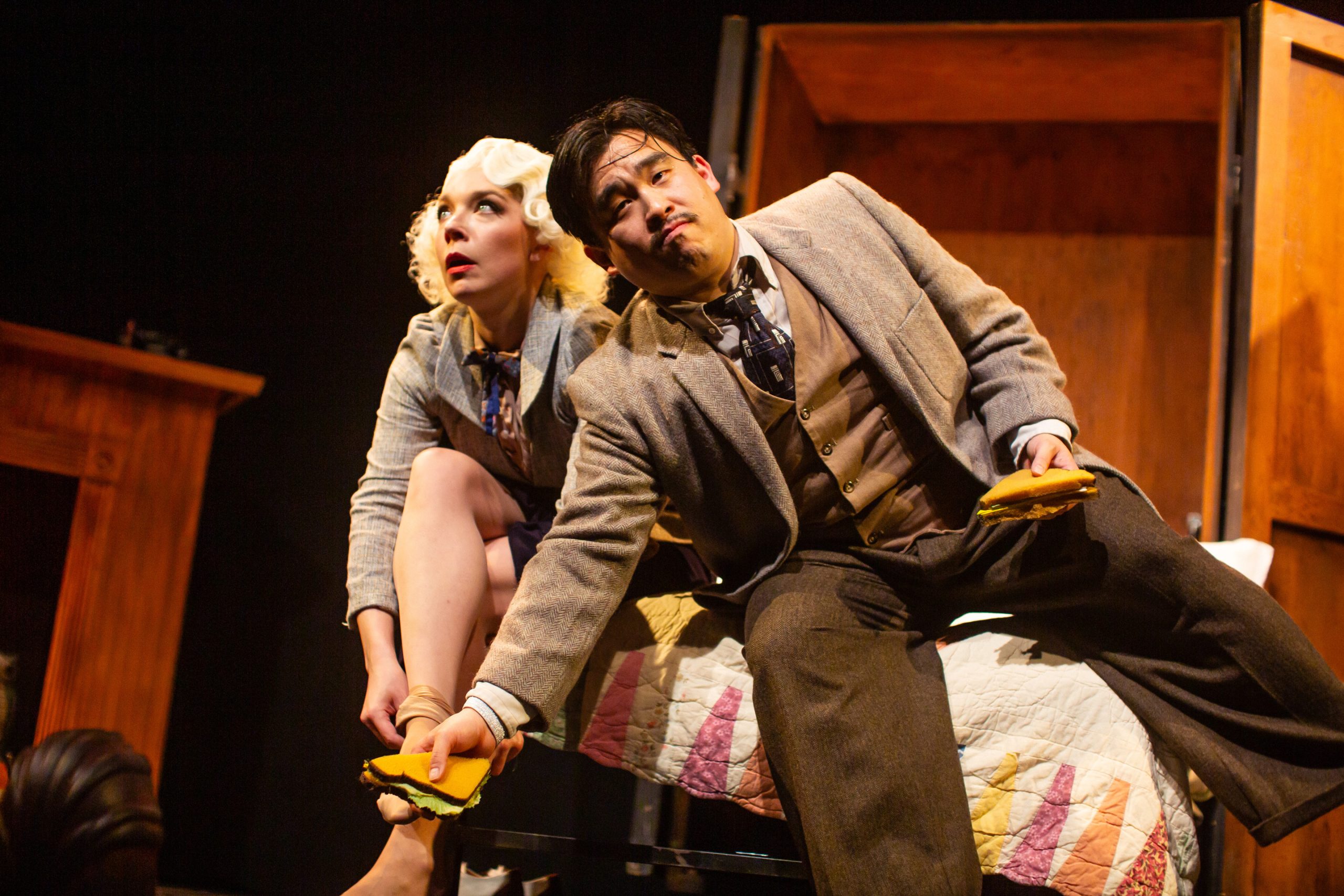 Pamela (Maggie Mason) and Richard Hannay (Phil Wong) struggle with a sandwich in "The 39 Steps," presented by San Francisco Playhouse March 7 - April 20.