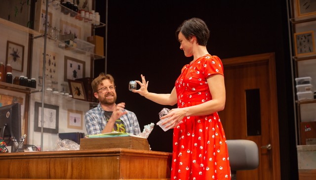 Lindsay (Jessica Lynn Carroll, right) shows an insect specimen to Jeff (Lucas Verbrugghe).