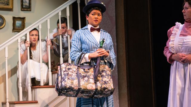 Mary Poppins (El Beh) arrives at Banks household, to the surprise of Jane Banks (Grace Hutton), Michael Banks (Billy Hutton) and Mrs. Bill (Marie Shell*).