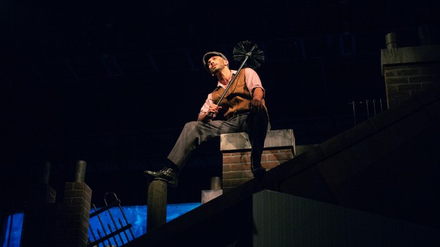 Bert (Wiley Naman Strasser) sits on a rooftop.