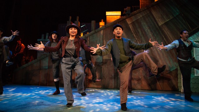 The chimney sweeps (Catrina Manahan and Dominic Dagdagan, center) step in time.