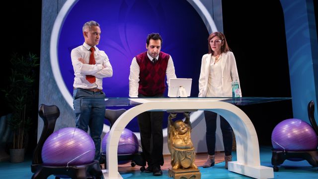 Fred (Ryan Morales) and Joan (Susi Damilano*) listen in on Raj's (Bobak Cyrus Bakhtiari*) phone call with his parents.