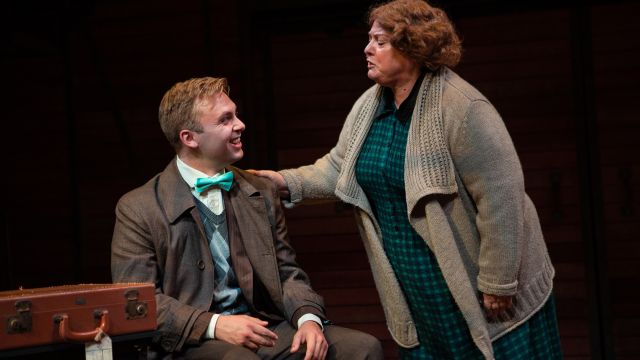 Fräulein Schneider (Jennie Brick*) welcomes Clifford Bradshaw (Atticus Shaindlin*) in 'Cabaret' at San Francisco Playhouse.
