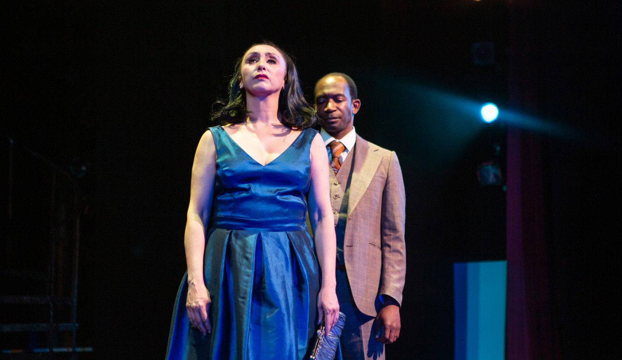 Sally Durant Plummer (Natascia Diaz*, left) faces reality and reunites with her husband, Buddy Plummer (Anthony Rollins-Mullens*, right).