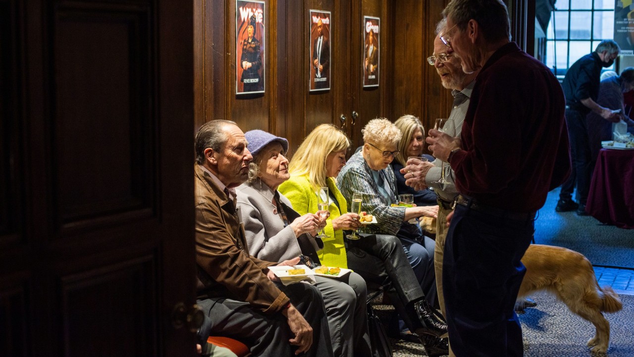 Supporters gather in the anteroom.