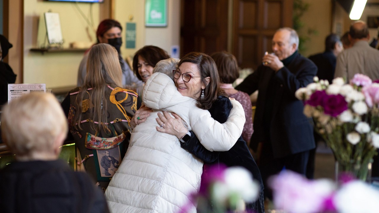 Producing Director Susi Damilano hugs a supporter at the Season Announcement Party.